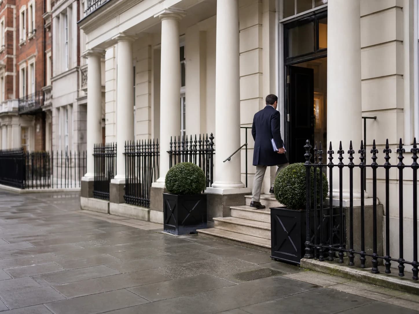 Patient arriving at an understated central London clinic for a knee consultation