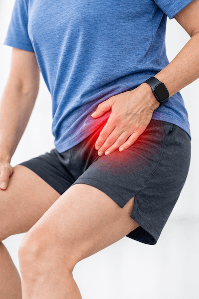 Patient stretching with hip discomfort