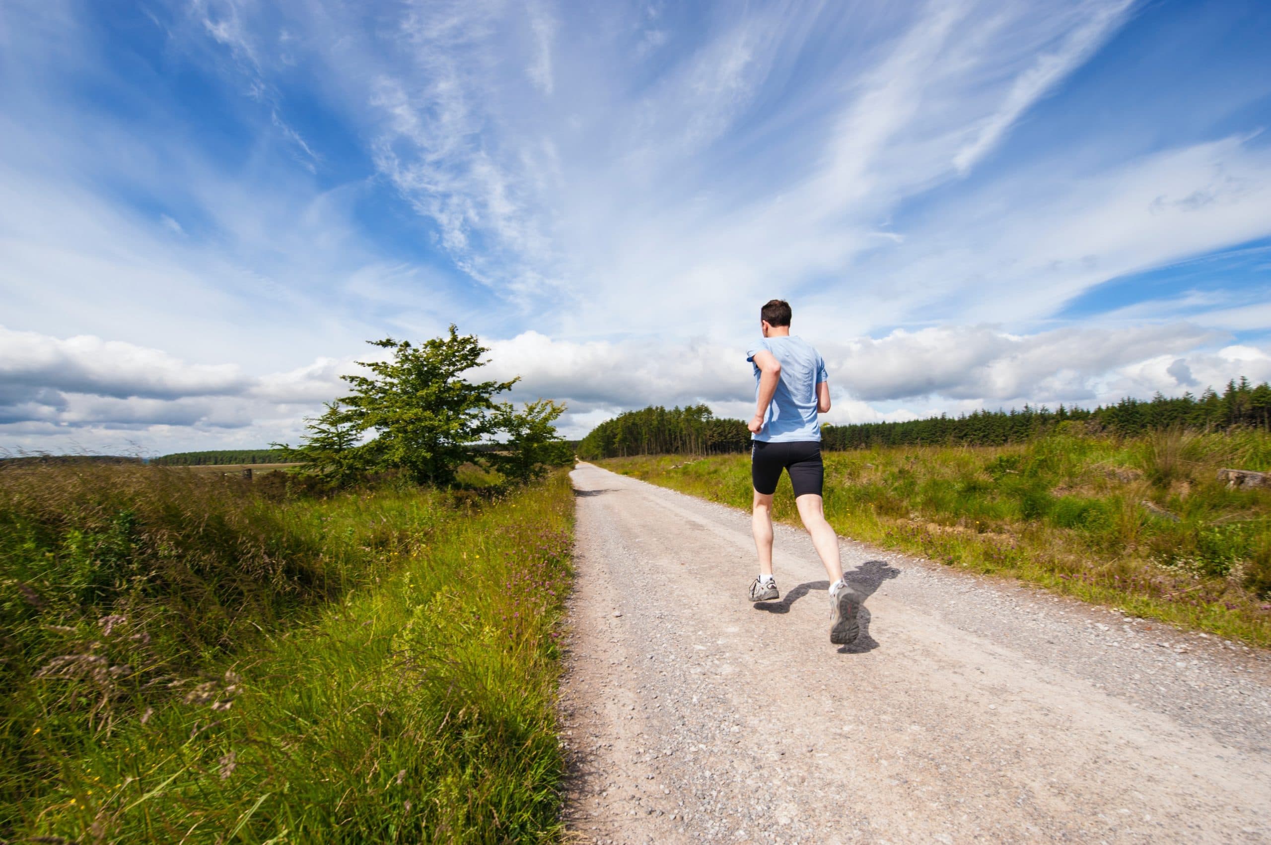 Runner jogging on a rural track