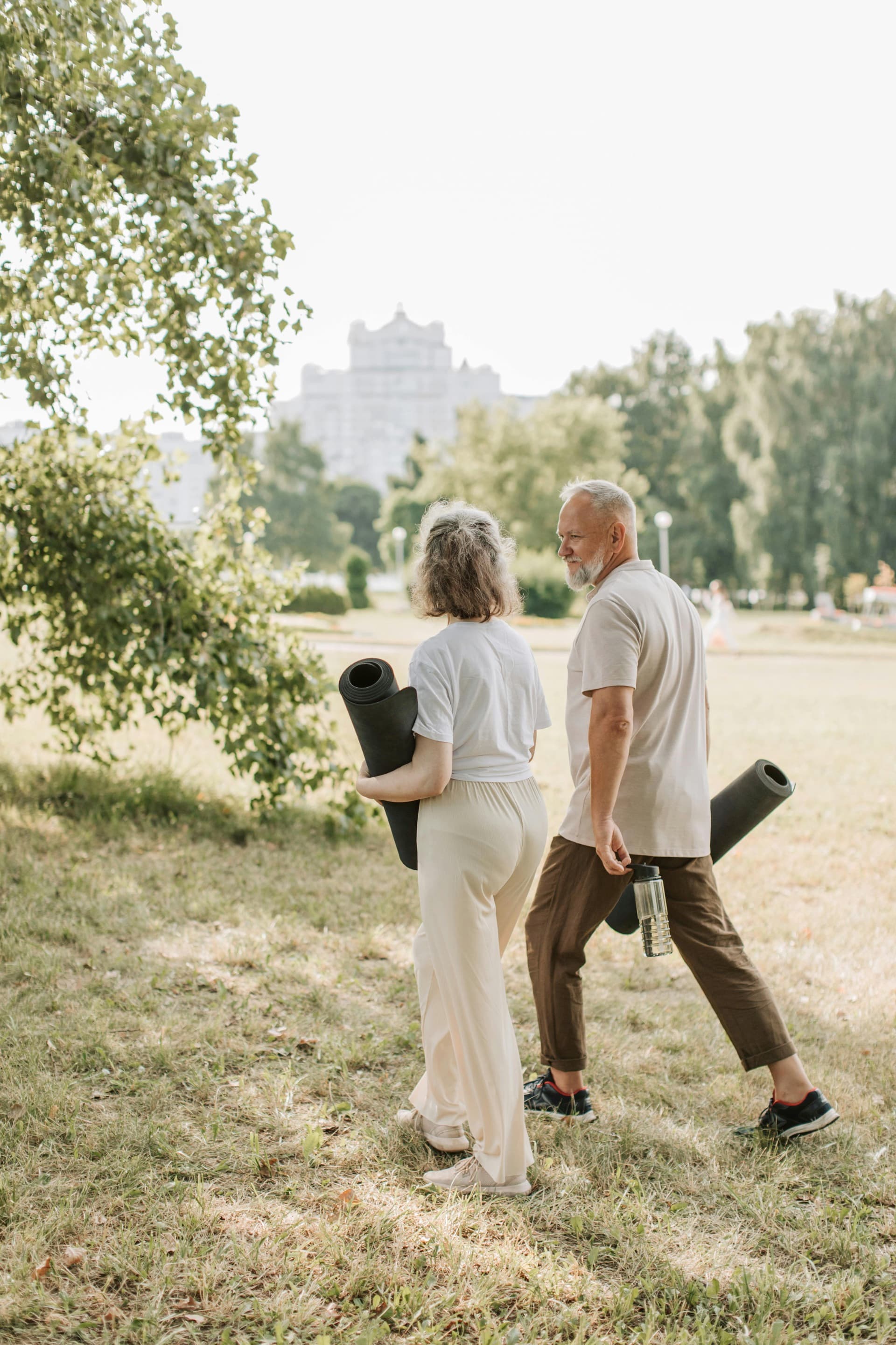Older couple staying active outdoors after knee symptom improvement